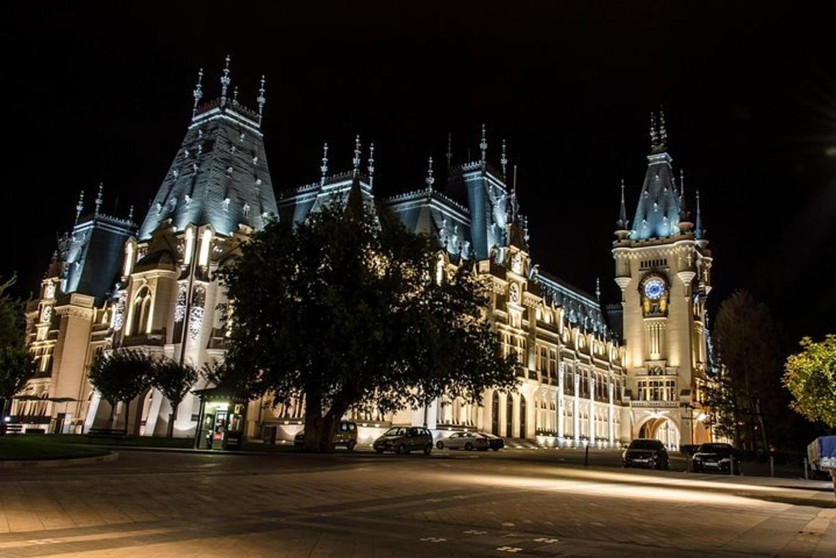 a large building with a clock tower at night