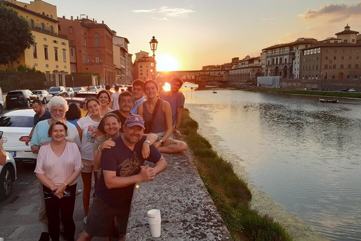 a group of people posing for a picture next to a river