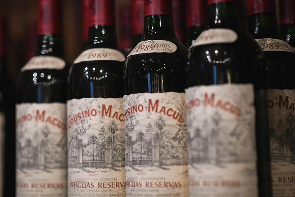 a bunch of bottles of wine are lined up