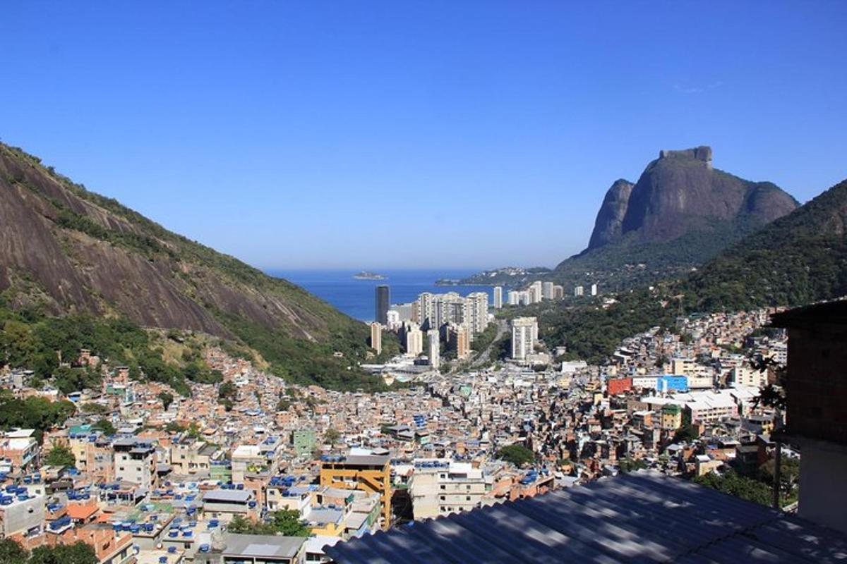 a view of a city with mountains and the ocean