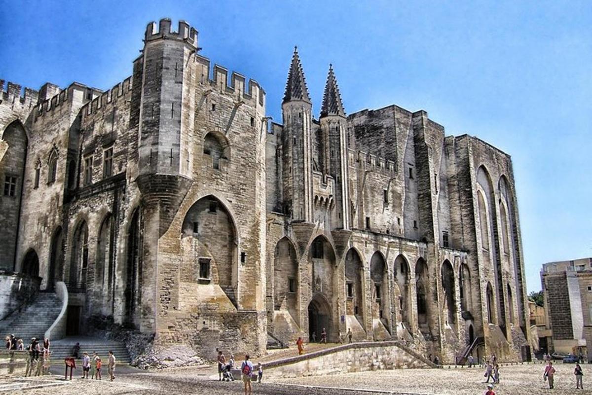 a large cathedral with people standing in front of it