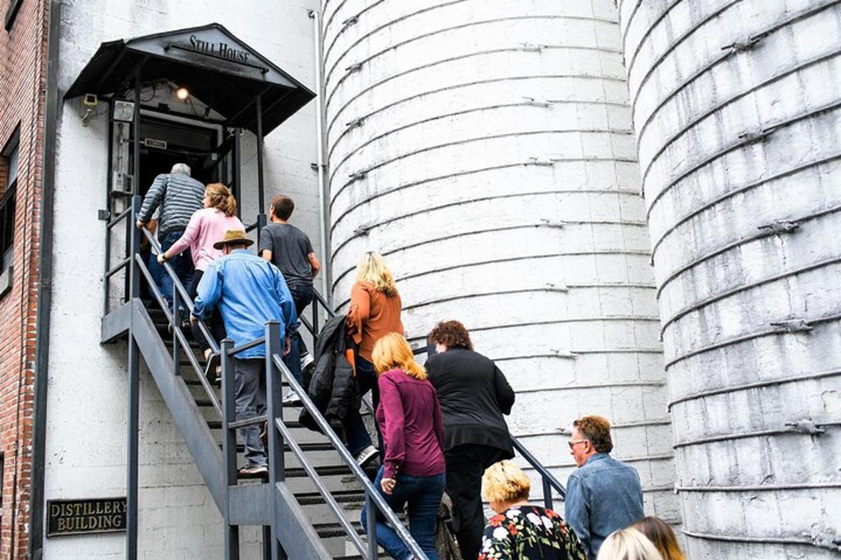 a group of people walking up a stairs in a building