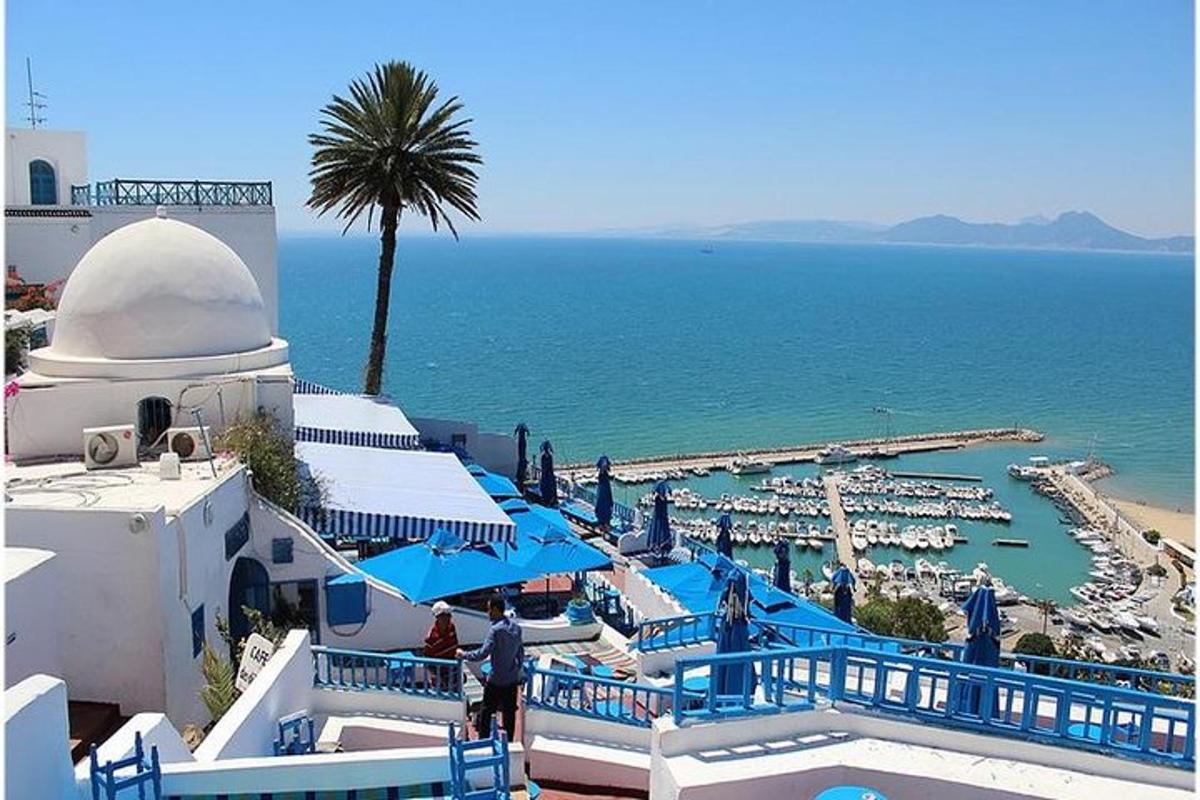a view of a resort with a pool and a beach