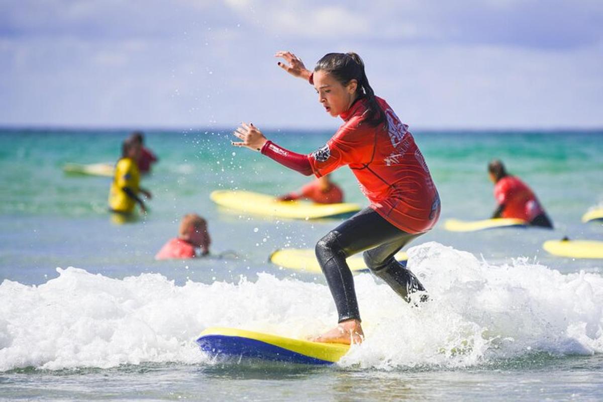 a woman riding a wave on a surfboard in the ocean