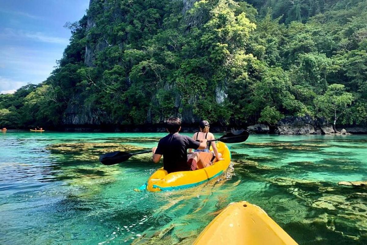 a man and a woman in a kayak in the water