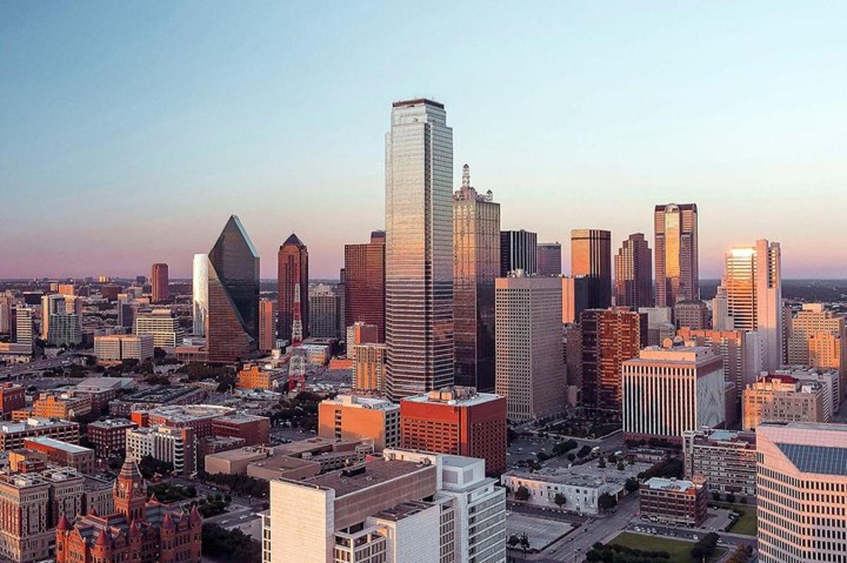 an aerial view of a city with tall buildings