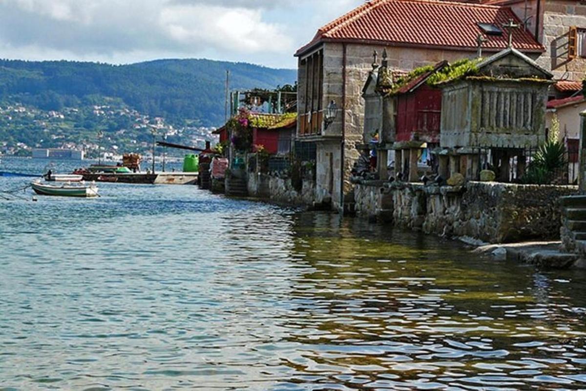 a river with houses and a boat in the water