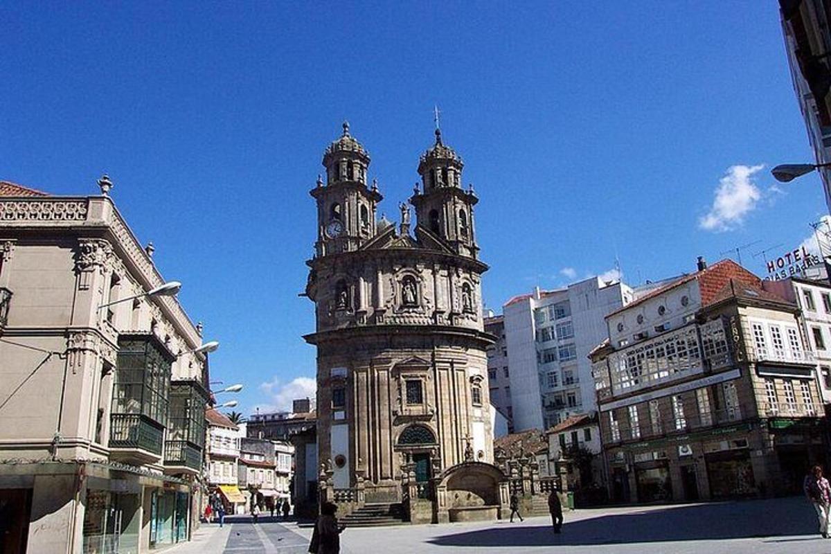 an old building with a clock tower in a city