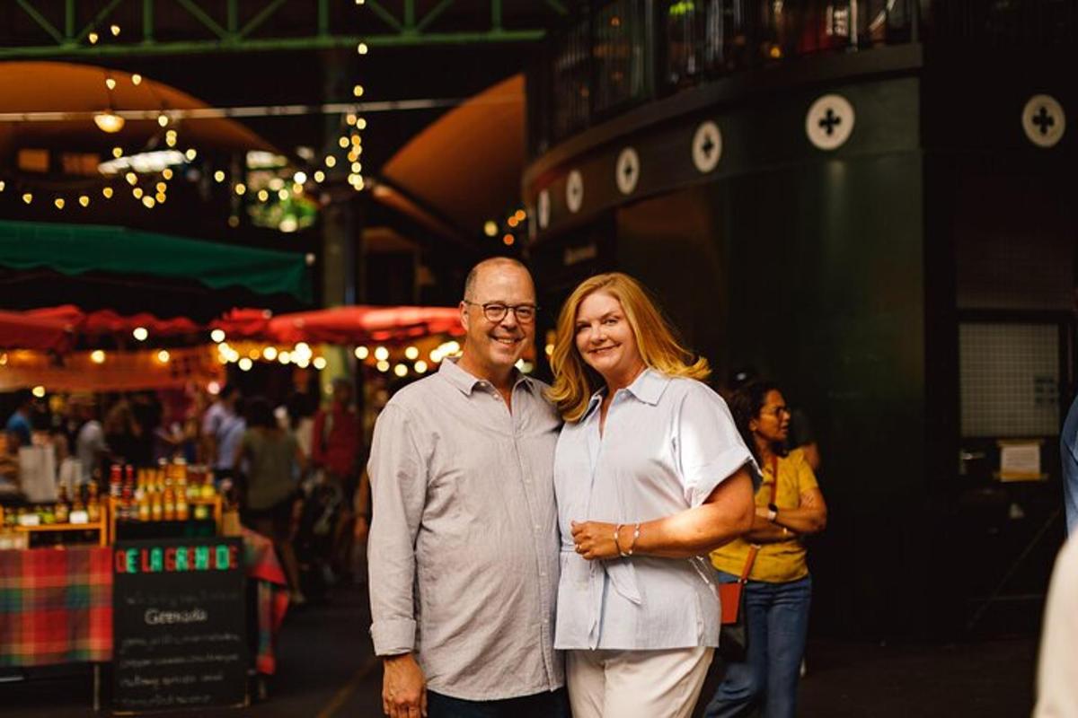 a man and woman posing for a picture on a street