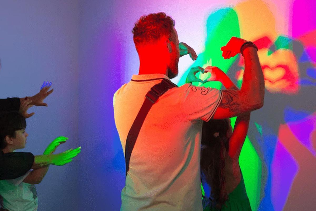 a group of people playing a video game in a room