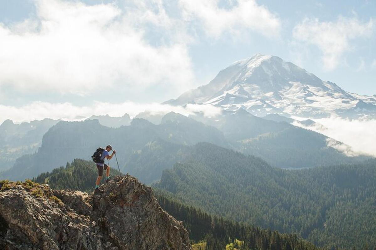 a man standing on the top of a mountain