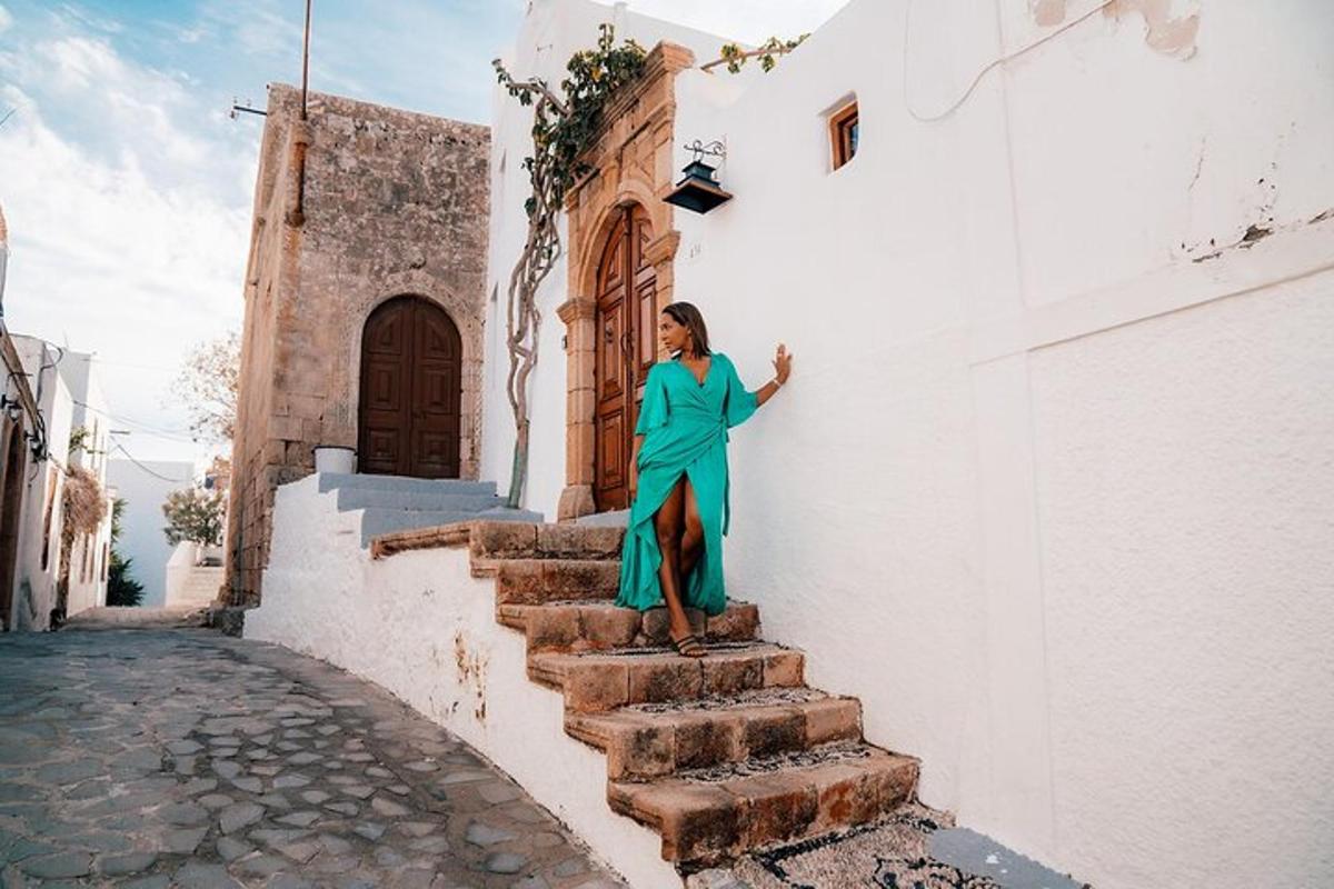 a woman in a green dress standing on the side of a building