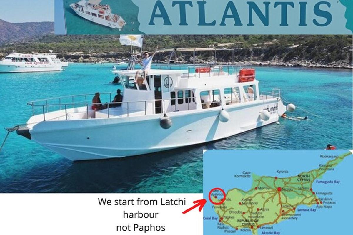 a white boat in the water with a map