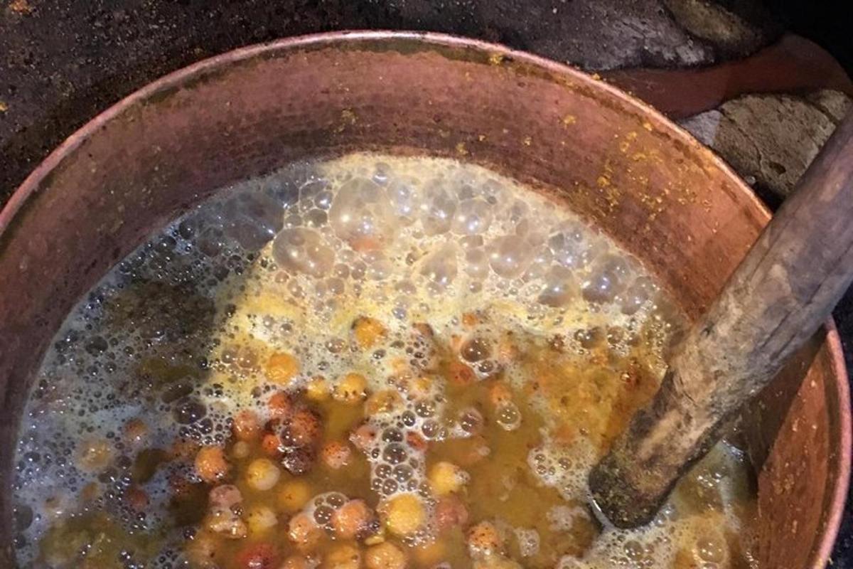 a pot of food with a wooden spoon in it