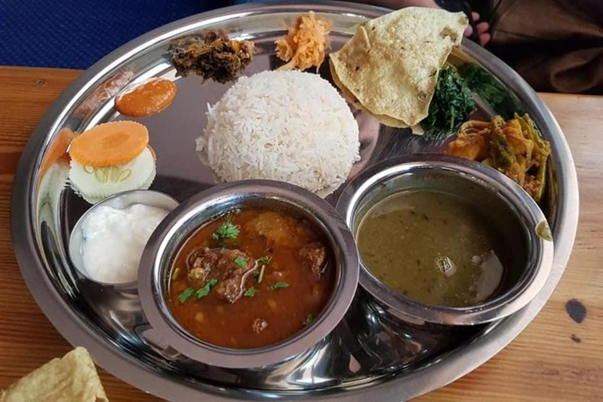 a plate of food with rice and different types of food