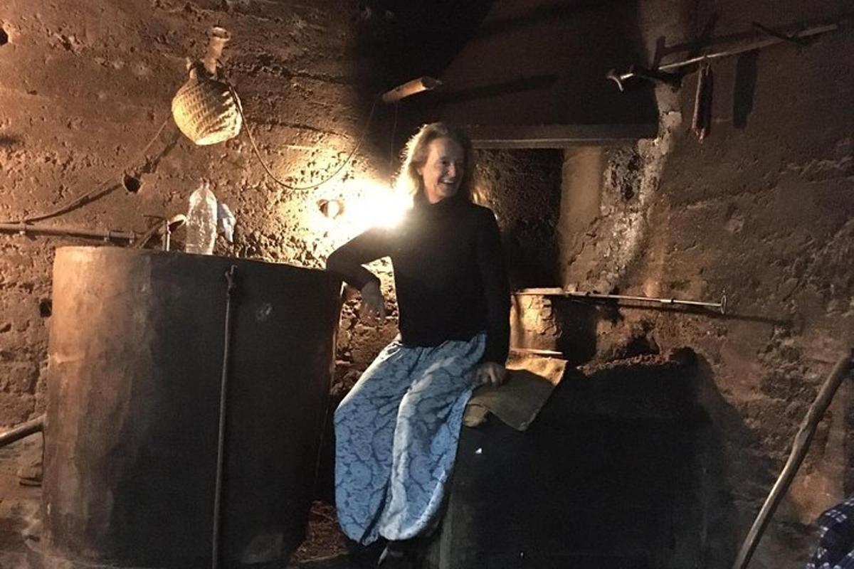 a woman is sitting on top of an oven