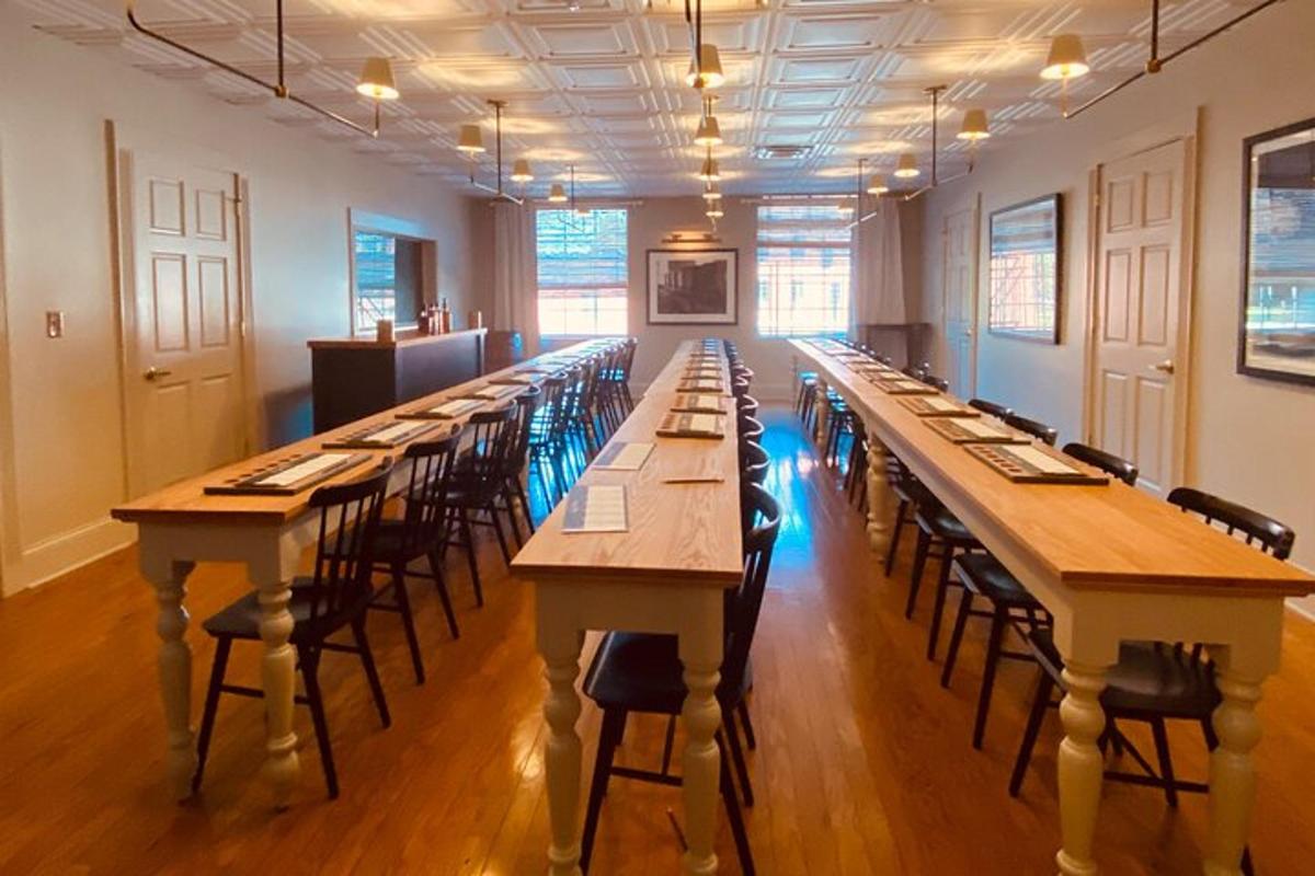 a long row of tables in a room with chairs