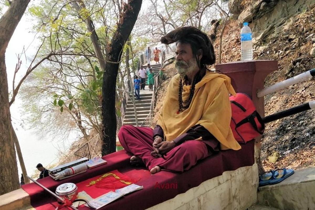a man sitting on a wall with