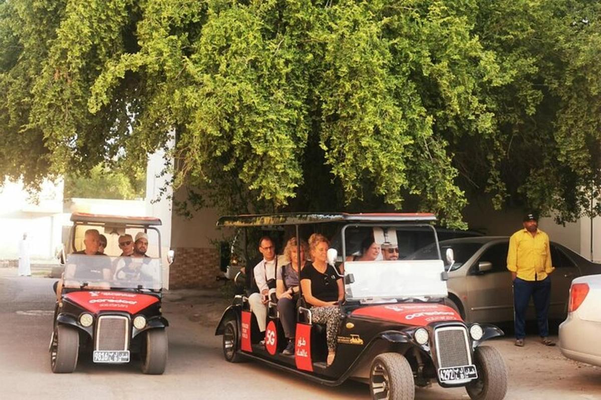 a group of people riding in an old car