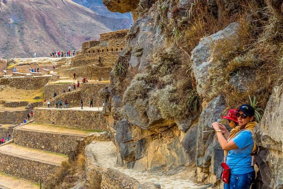 two women standing on the side of a mountain