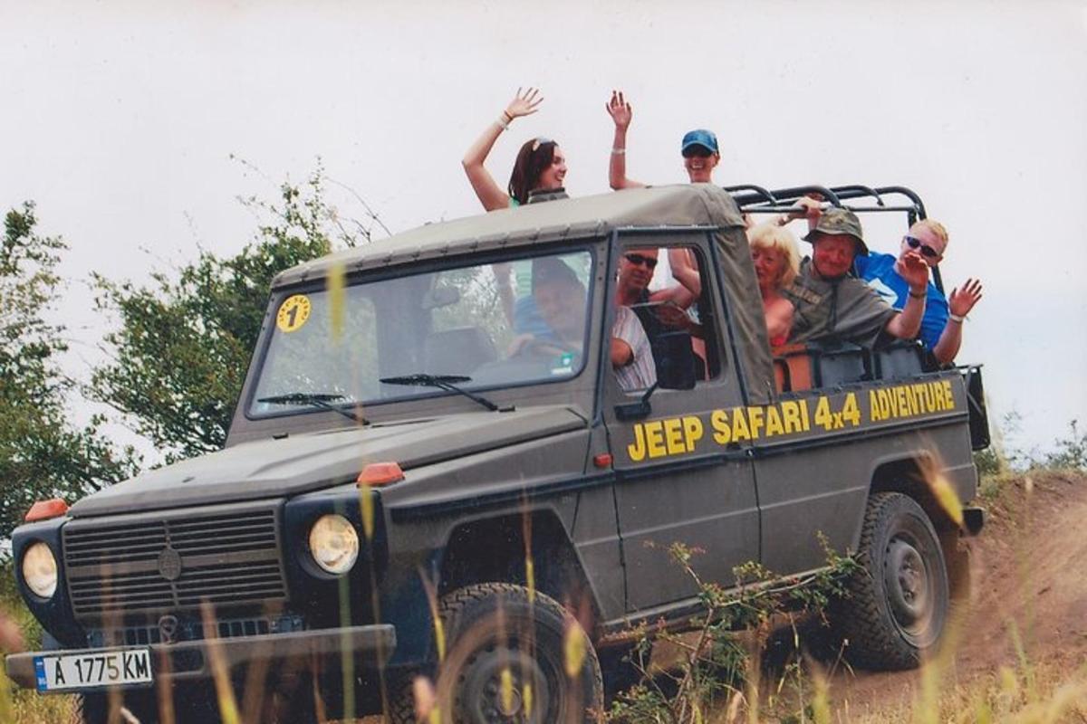 a group of people riding in the back of a truck