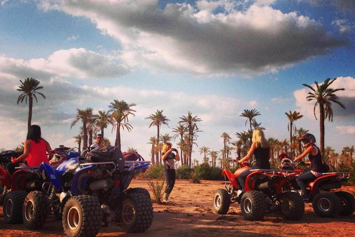 a group of people riding atvs on a dirt road