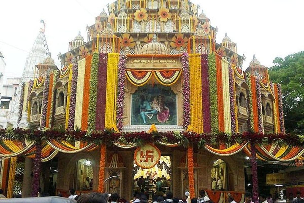 a crowd of people standing in front of a temple