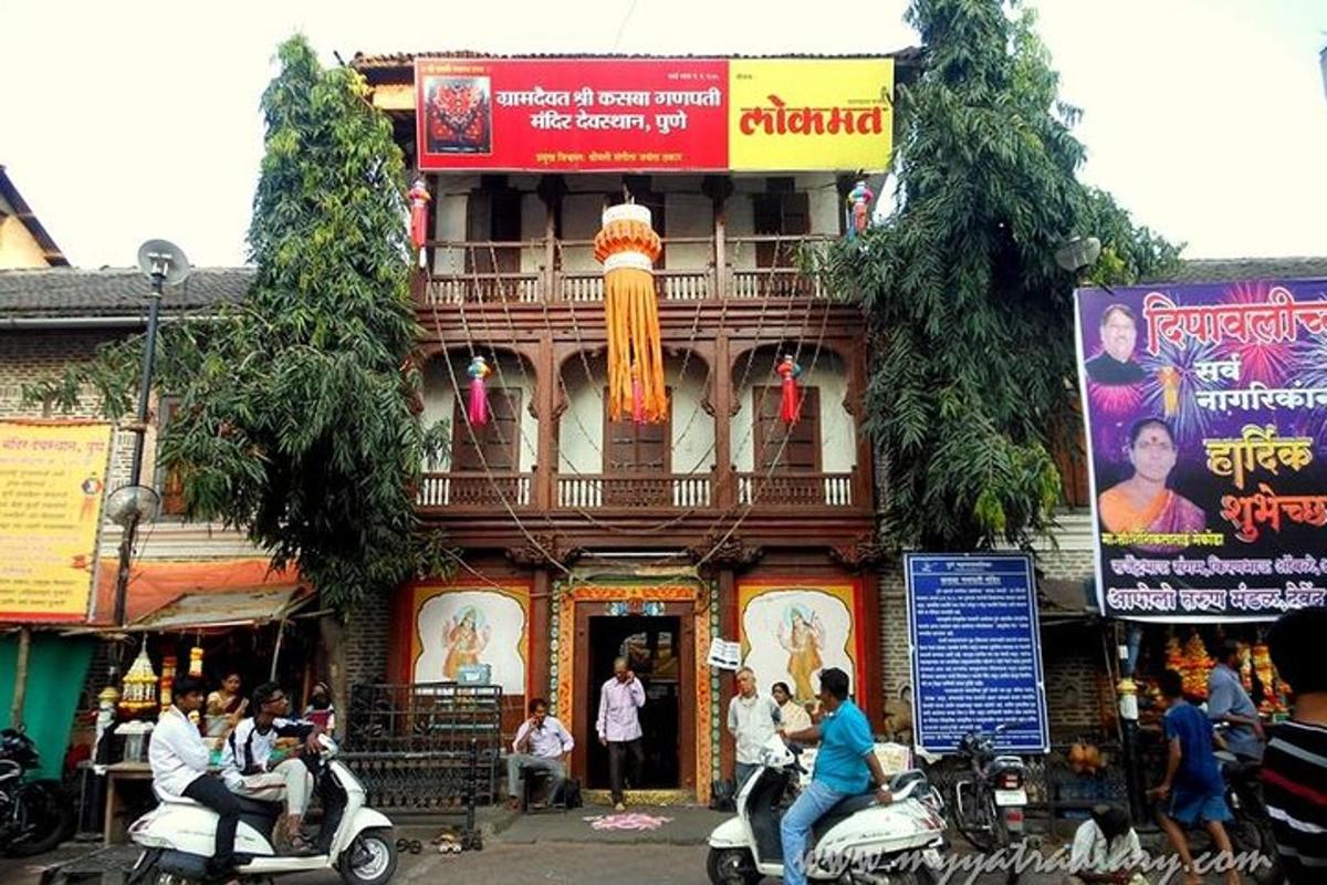 a building with people on scooters in front of it