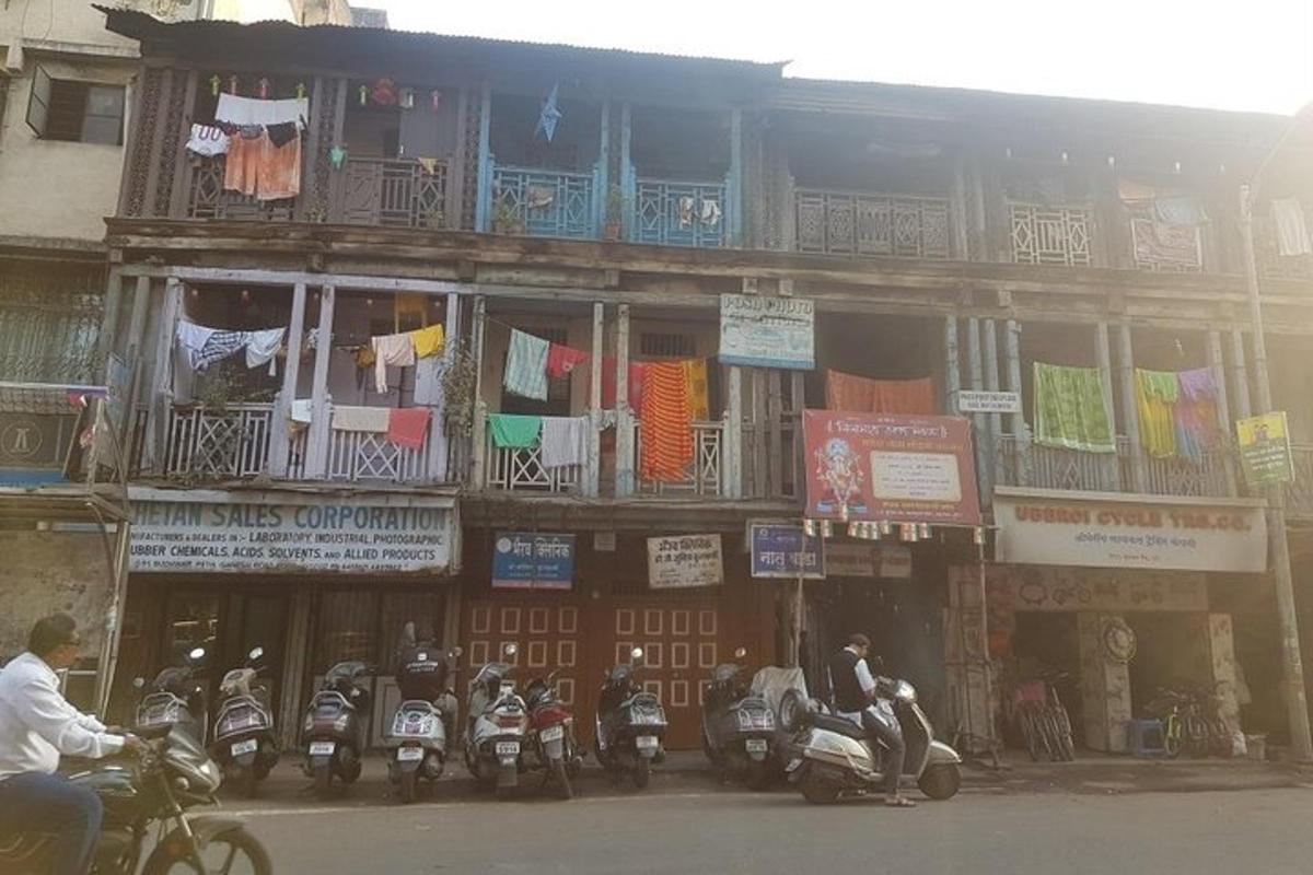 a group of motorcycles parked in front of a building