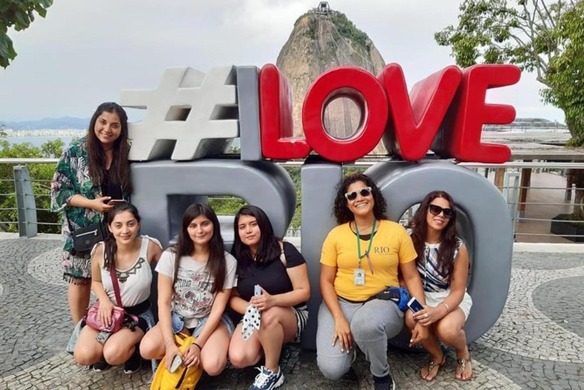 a group of women posing in front of the love sign