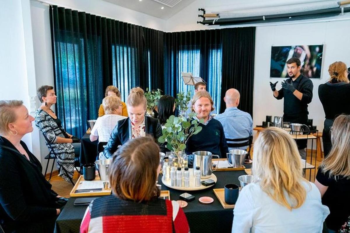 a group of people sitting around tables in a room