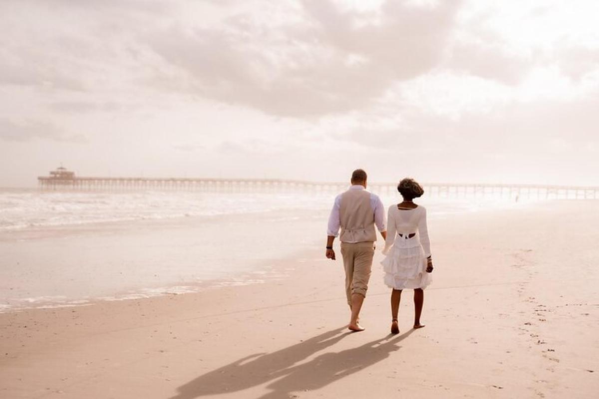 a man and a woman walking on the beach