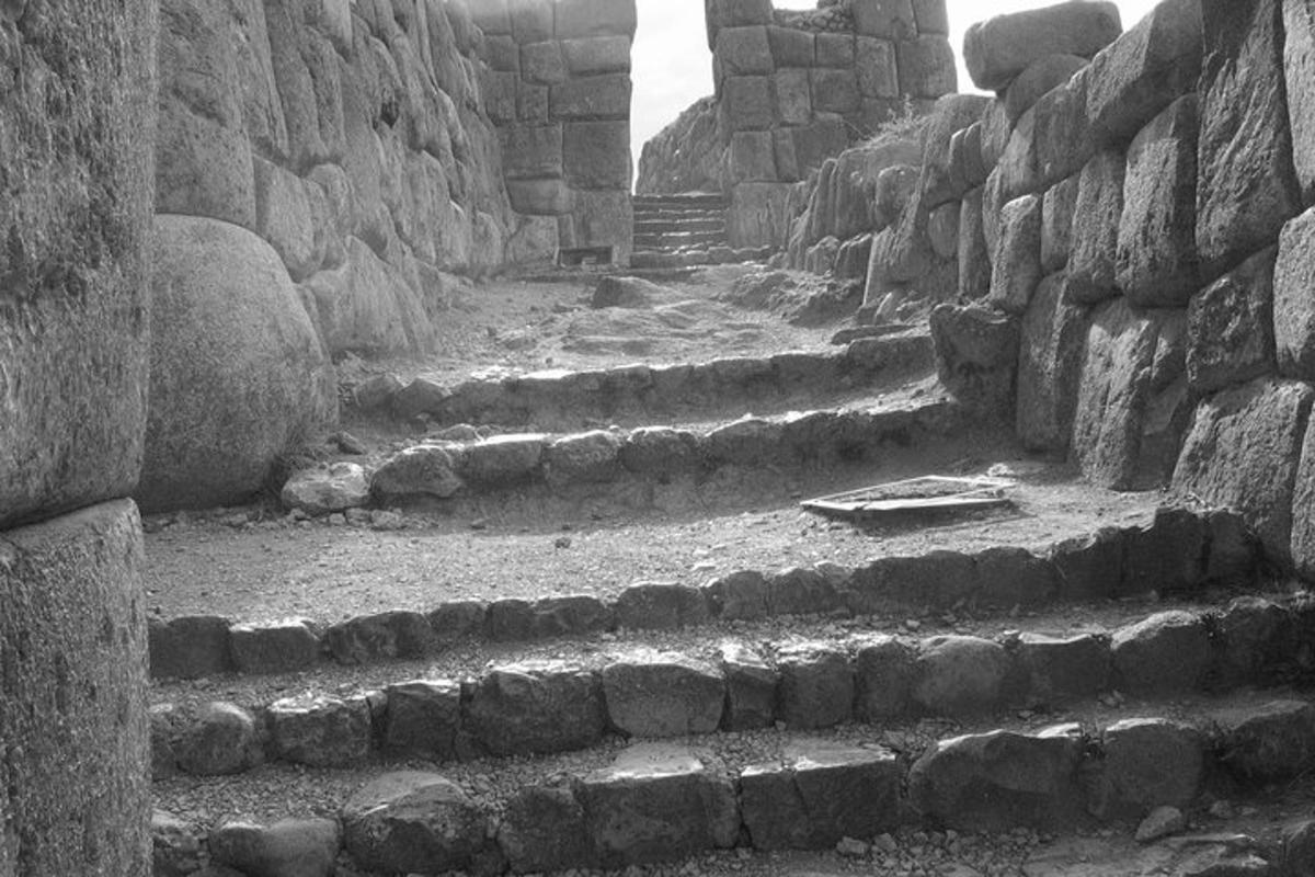 an old stone alley with steps in a building
