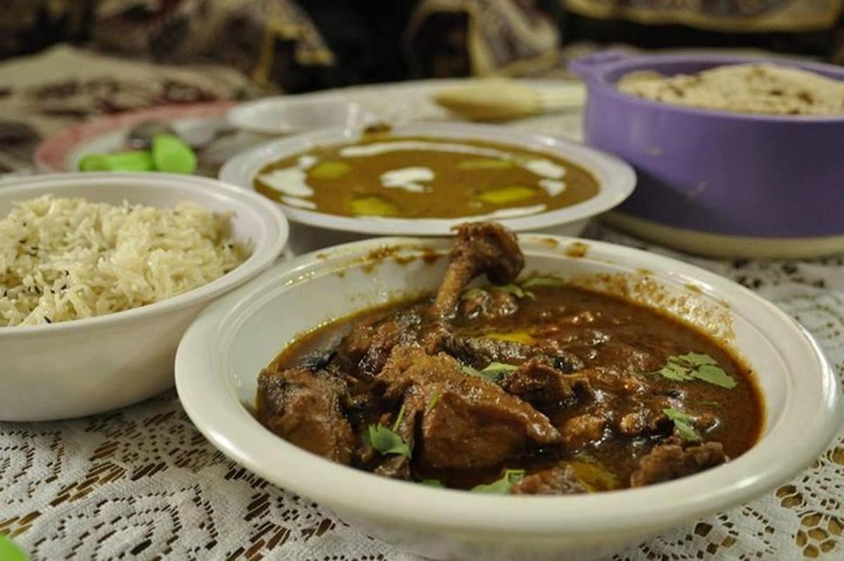 a table topped with bowls of food and rice