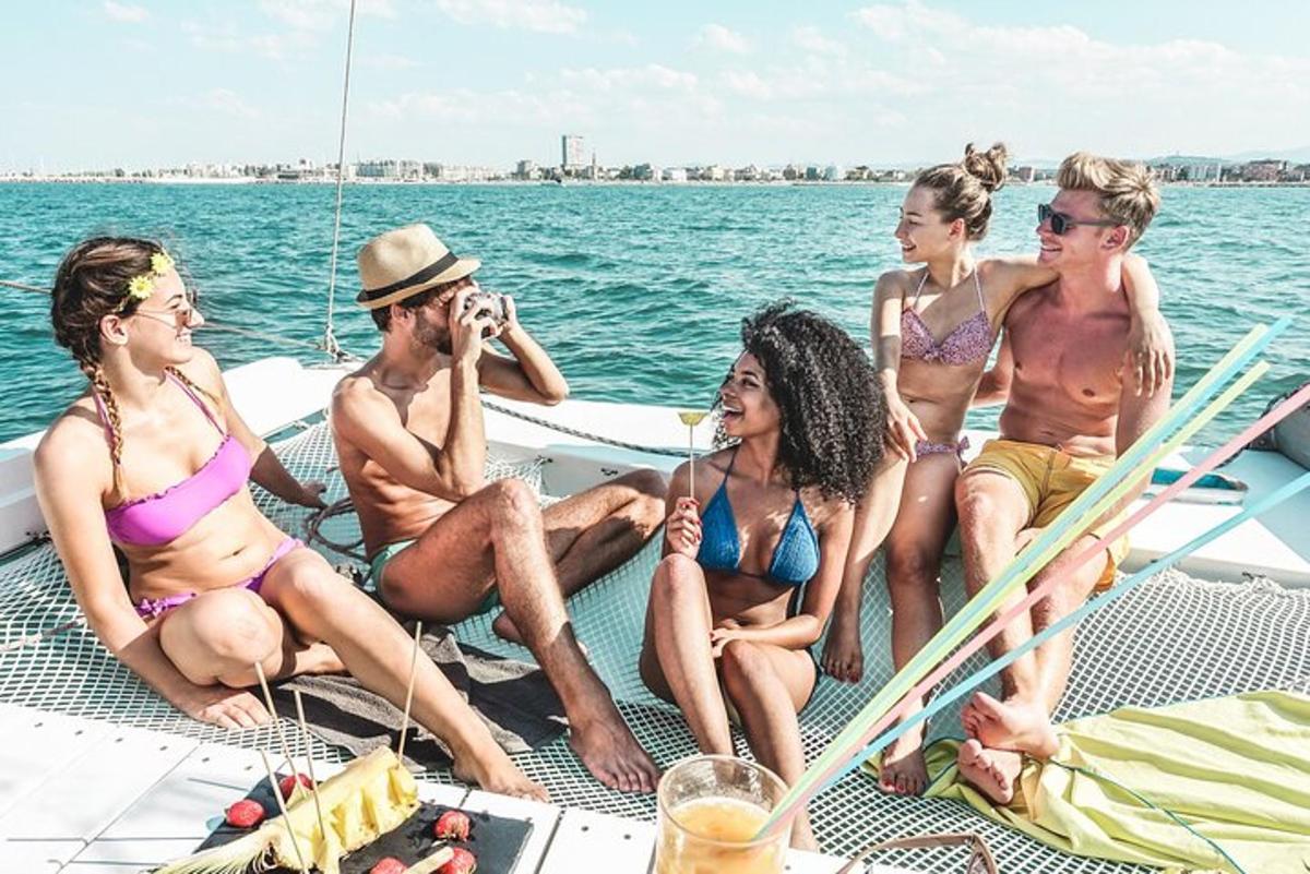 a group of people sitting on a boat in the water