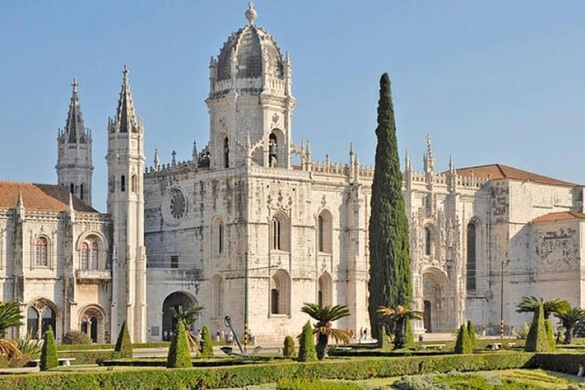 a large building with a garden in front of it