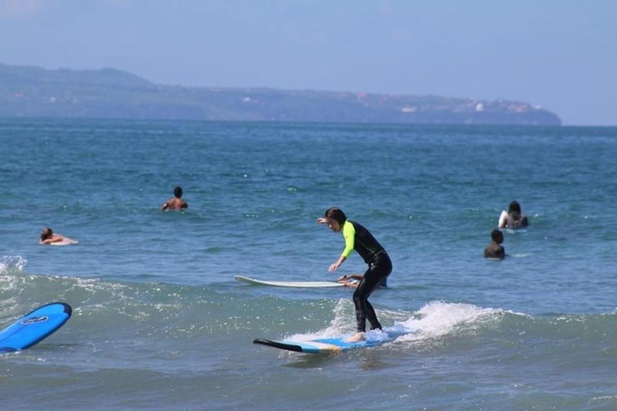 a person riding a wave on a surfboard in the ocean