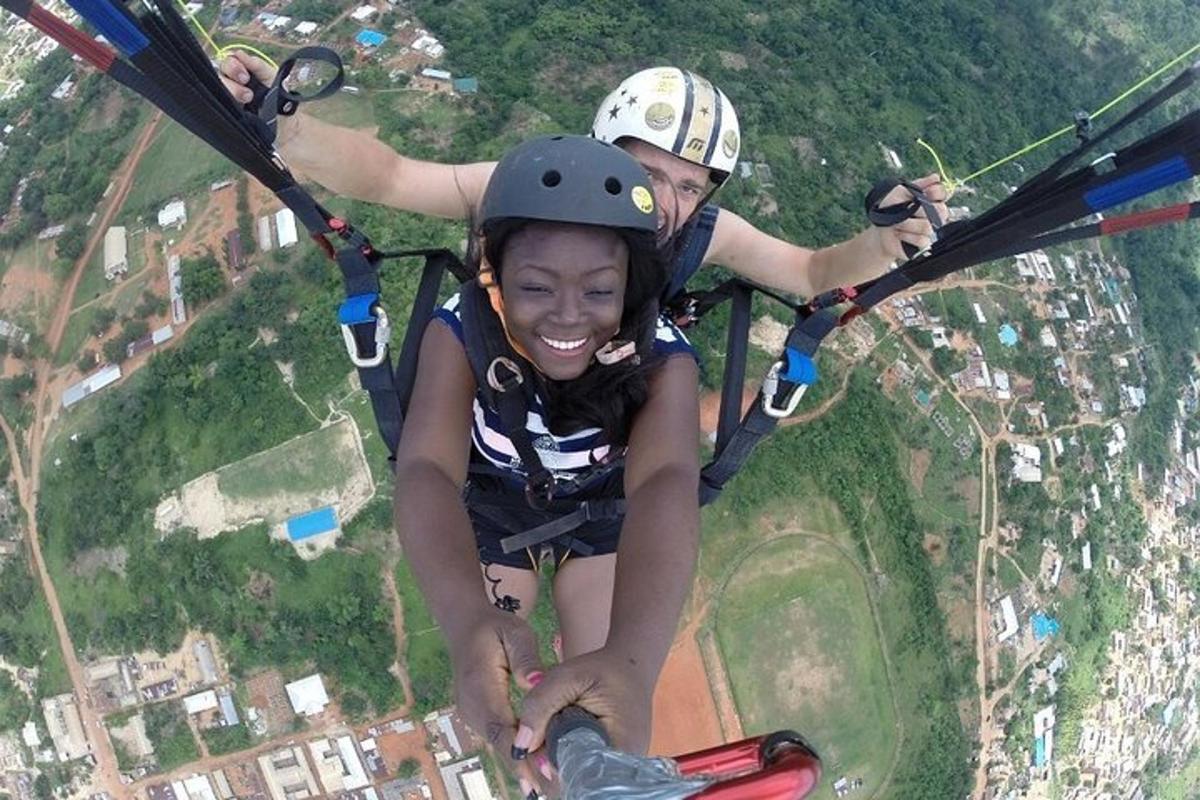 a man and a woman riding on a parachute