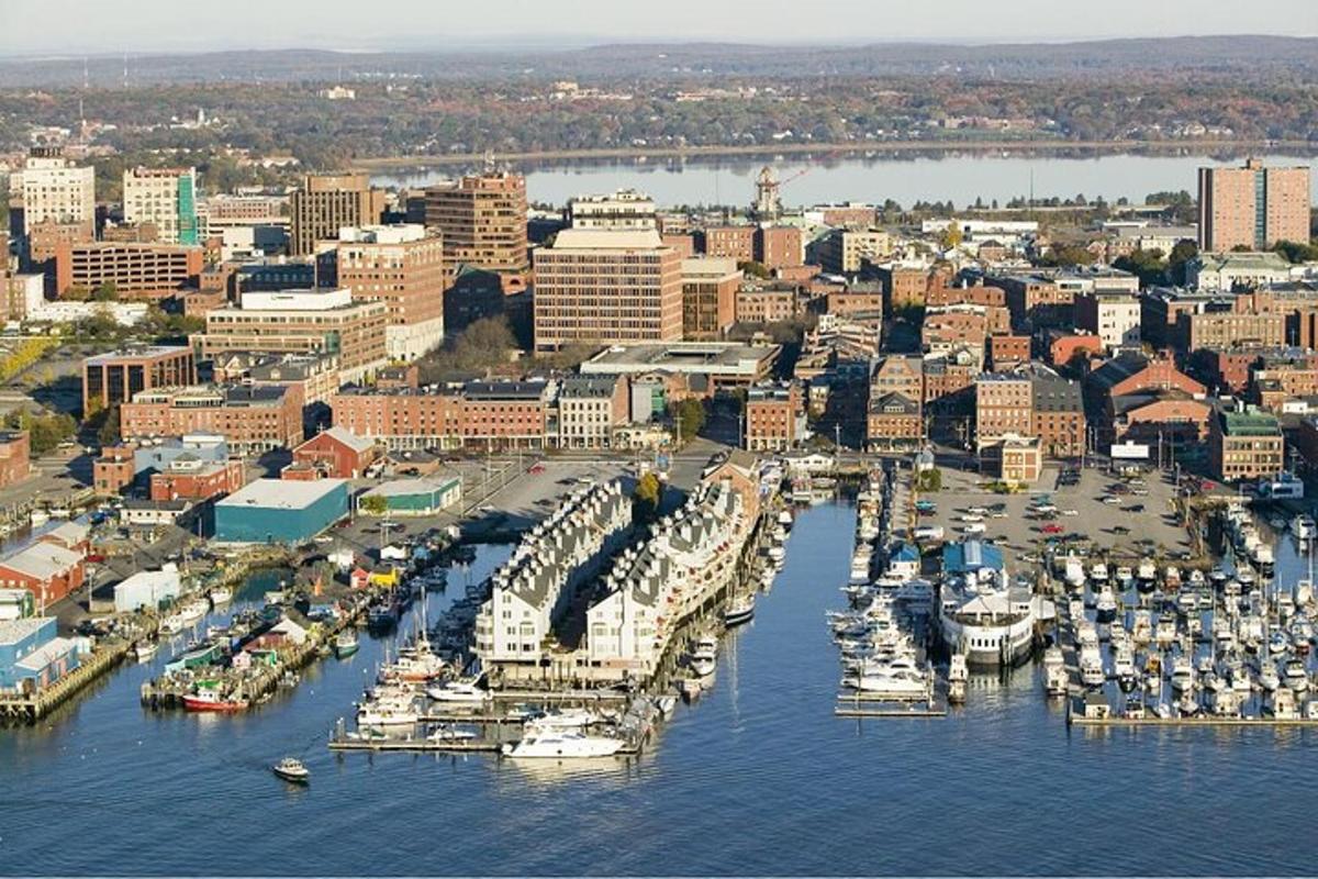 an aerial view of a harbor with boats in the water