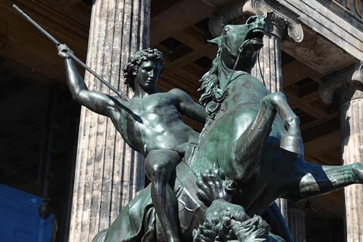 a statue of a woman with a horse in front of a building