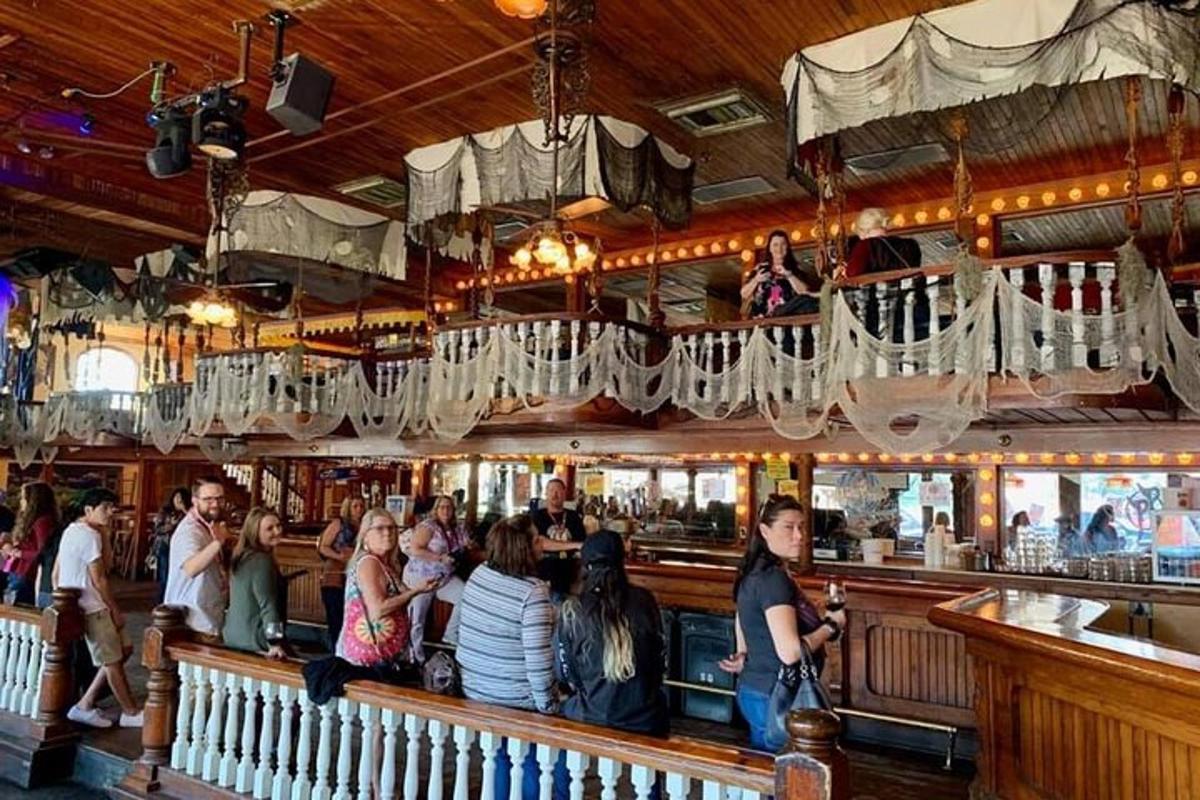 a group of people sitting at a bar