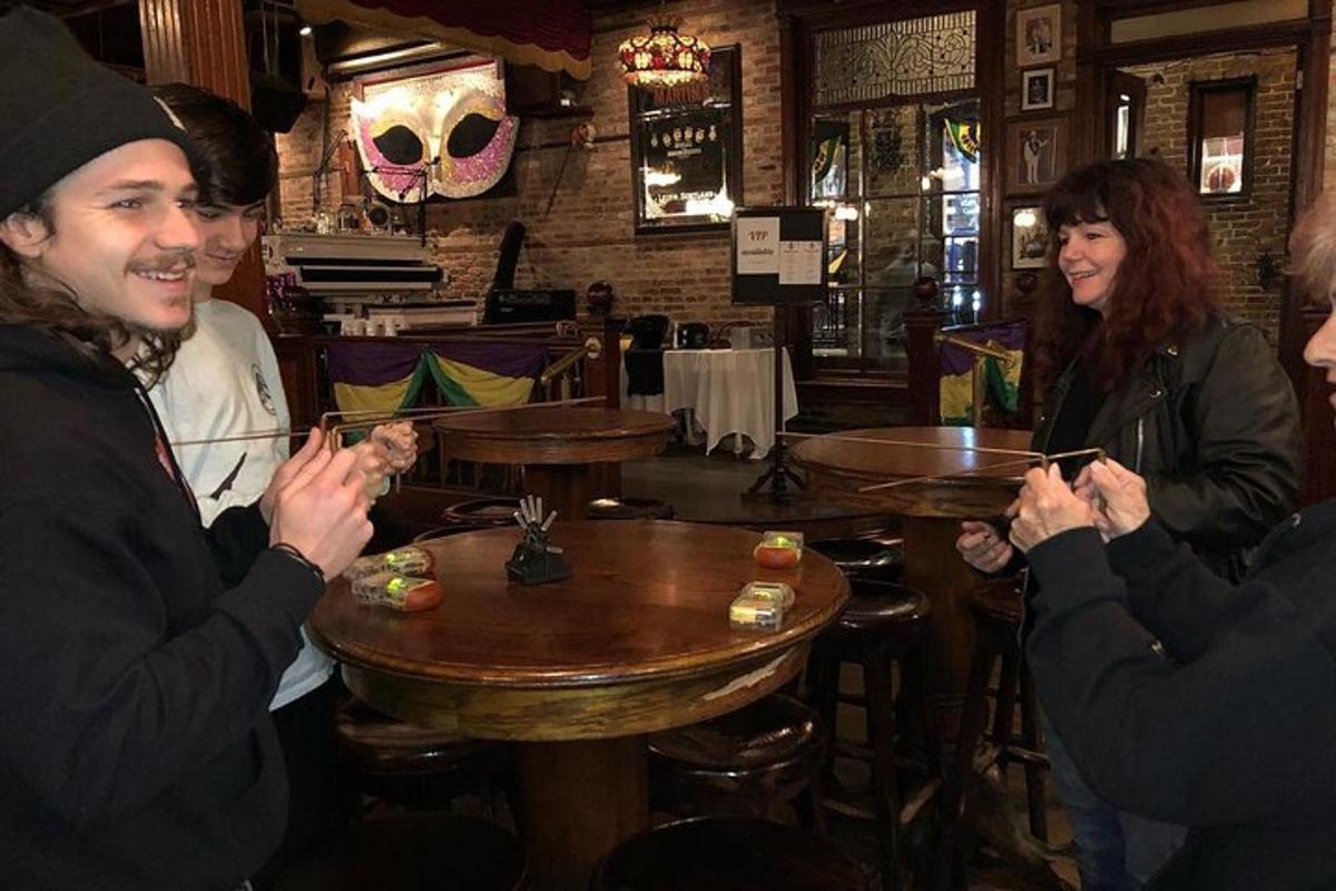 a group of people sitting around a table in a restaurant