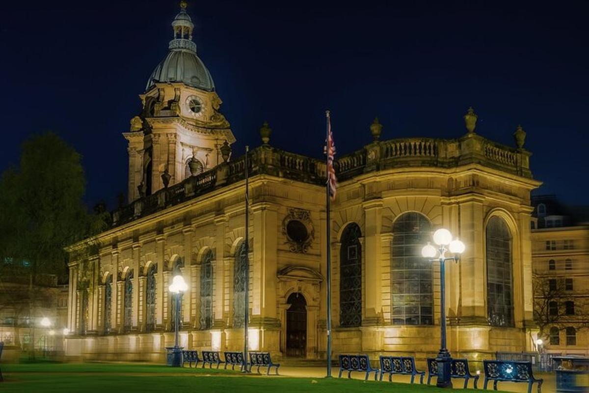 a large building with a clock tower at night