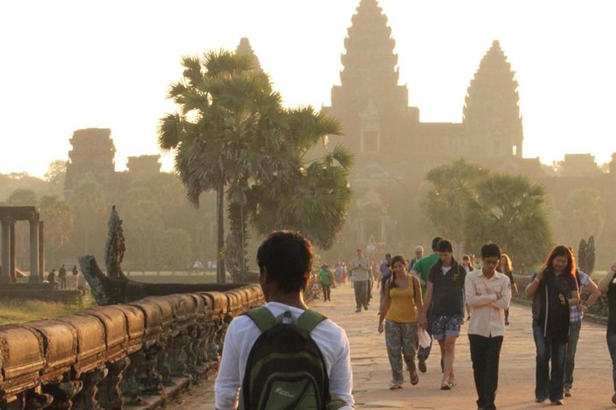 a group of people walking in front of a temple