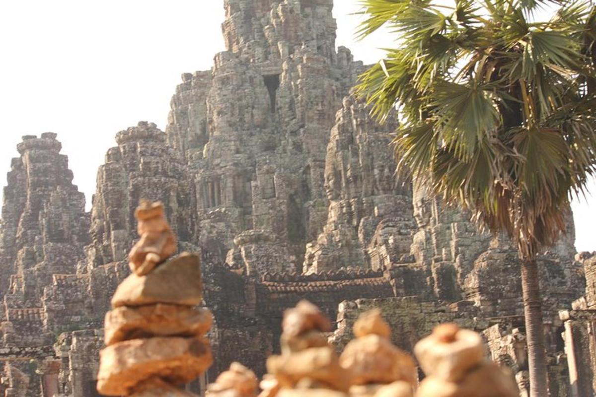 a stack of food in front of a stone building