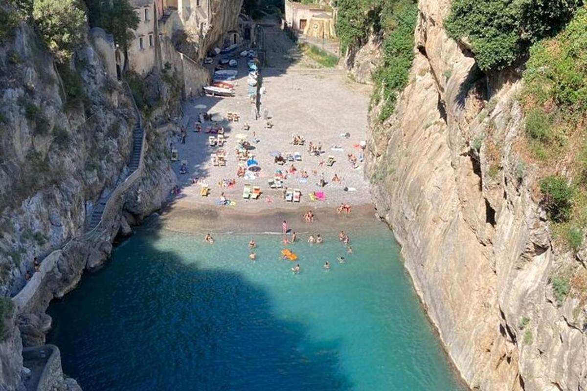 a group of people on a beach in the water