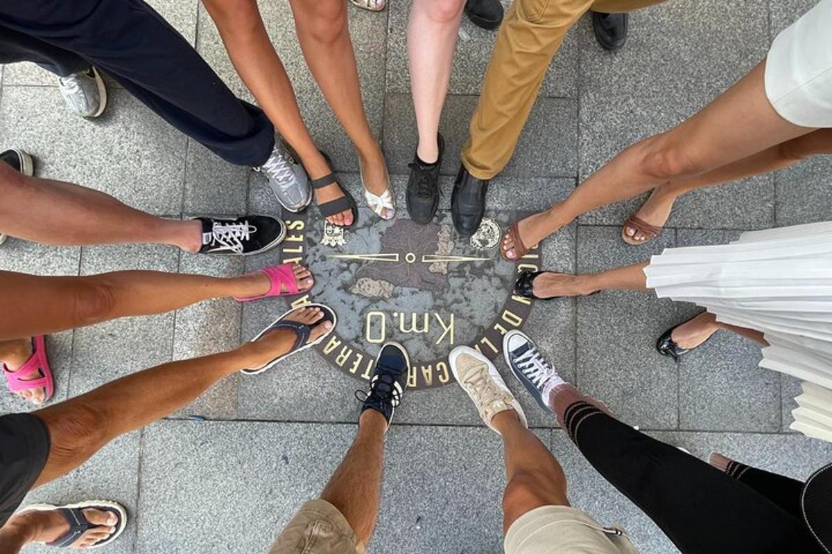 a group of people standing around a sign in a circle