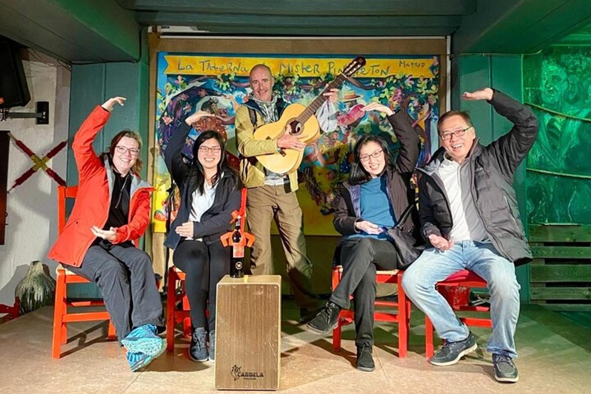 a group of people sitting in chairs in front of a wall