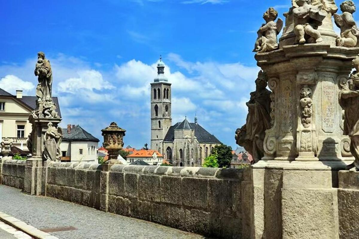 a stone bridge with a city in the background