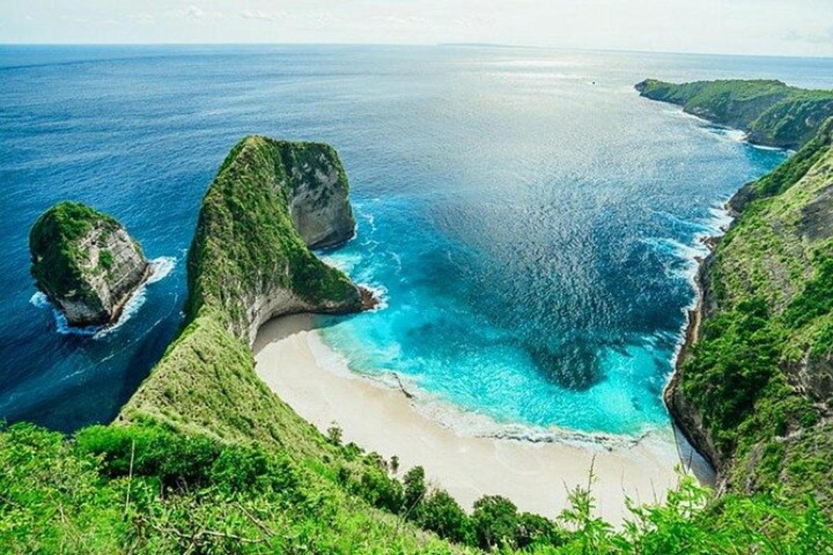 an aerial view of a beach with rocks in the ocean